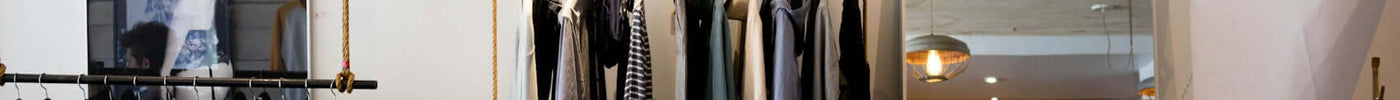 Stylish boutique showcasing seasonal fashion pieces with a luxury streetwear aesthetic in Barcelona.