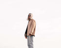Model showcasing sustainable fashion practices at MaisonGrozavu in a luxe streetwear outfit under natural lighting.