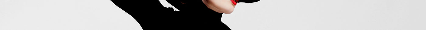 woman in black long sleeve shirt and black hat