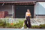 Fashion-forward model in luxury streetwear showcasing future proof sustainable fashion strategies in an urban setting.