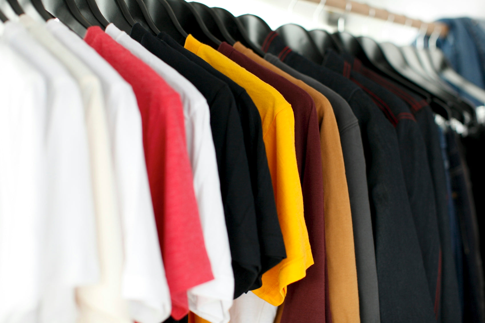 closeup of hanged shirts on rack