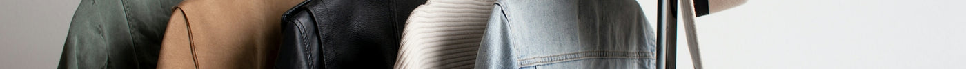 one cowboy hat and five jackets hanged on clothes rack
