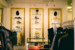 Sustainability in brand fashion showcased in a luxury streetwear store with stylish apparel and sneakers.