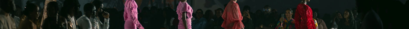 A group of women walking down a runway