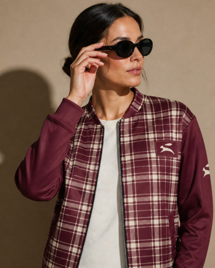 Close-up of the Grozavu hare patch on the Heritage Tartan Bomber in Bordeaux, worn by the model