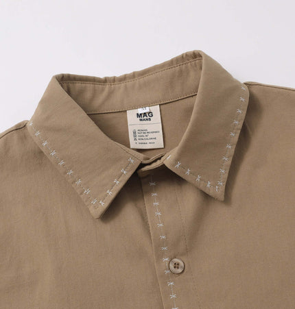 Minimal Casual Loose Short Sleeve Shirt with flip collar and decorative stitching details.