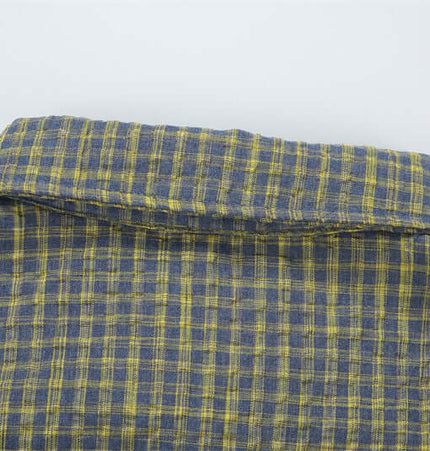 Casual Plaid Shirt – Relaxed Fit showing the classic collar and plaid pattern in blue and yellow tones.