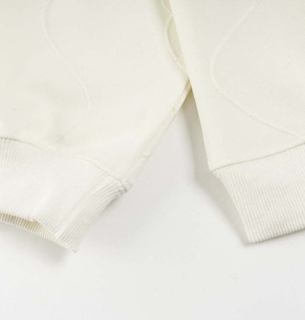 Embroidered Letter Hoodie – Loose Fit close-up of sleeve cuffs in white fabric.