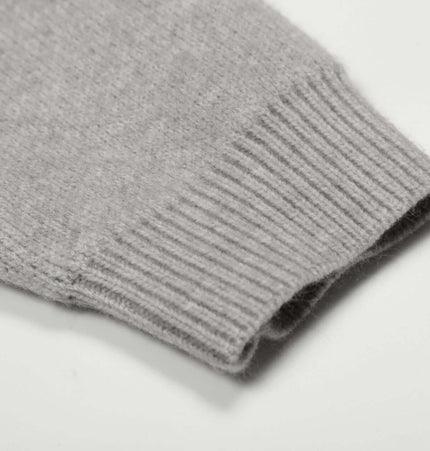 Close-up of the cuff of the Letter Jacquard Knit Hoodie – Loose Fit in soft gray tone.
