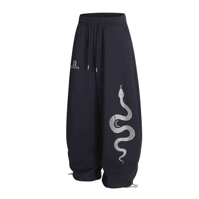 White rhinestone snake print pants with Grozavu logo