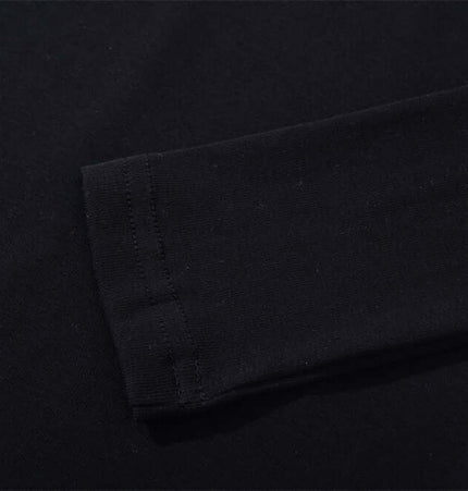 Long Sleeve Printed TShirt - Slim Fit close-up of black fabric and sleeve detail.