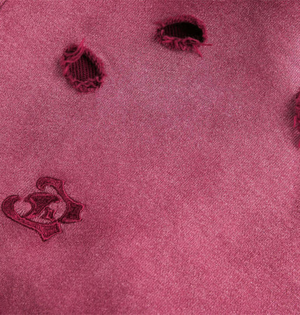 Close-up of the Tie-Dye Gradient Half-Zip Hoodie – Loose Fit showing distressed details and embroidery.