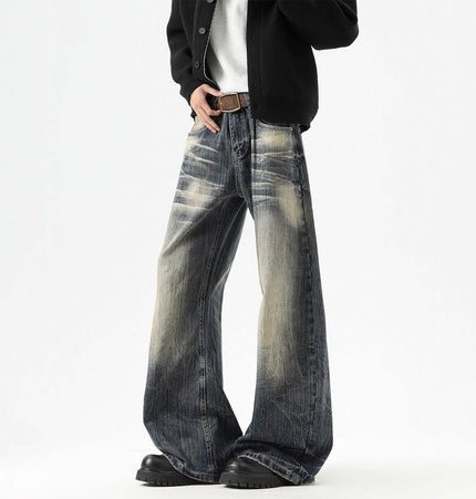 Knife-Edge Denim Trousers – Loose Fit model showcasing unique knife-edged seam detailing and a vintage distressed finish.
