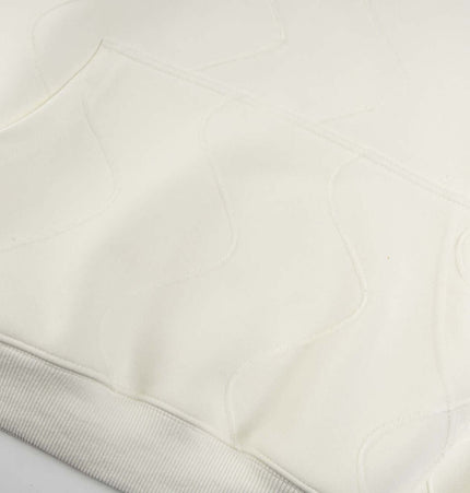 Embroidered Letter Hoodie – Loose Fit detailed view showing soft cotton fabric and front pocket.