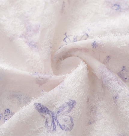 Close-up of fabric showcasing the Butterfly Jacquard Printed Shirt's intricate butterfly design and soft texture.