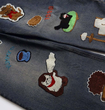 Vintage Washed Cartoon Embroidered Jeans featuring playful towel embroidery and a bold vintage feel.