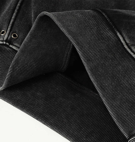 Close-up of the fabric details and cuff of the American Retro Washed Hoodie – Loose Fit in black.