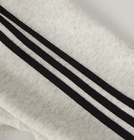 Detail of the Casual Pullover Sports Hoodie - Relaxed Fit showing black stripes on soft fabric.
