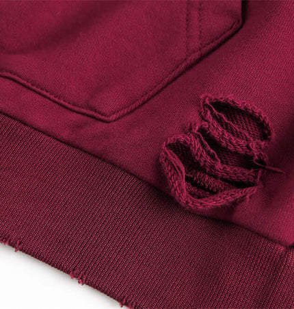 Detail of Tie-Dye Gradient Half-Zip Hoodie – Loose Fit showing distressed hole feature and soft fabric.