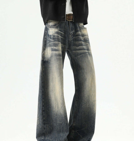Knife-Edge Denim Trousers – Loose Fit on model showcasing a relaxed fit with distressed details in a fashionable pose.