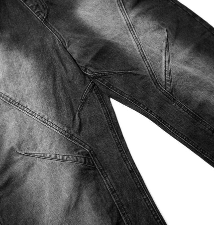 Distressed Pleated Reverse Denim Pants highlighting unique pleated panels and washed distressed finish.