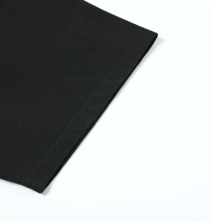 Washed Spray Print TShirt – Loose Fit showing the sleeve detail of a soft cotton blend fabric.