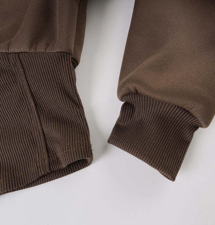 Solid Color Zip Hoodie – Casual Fit close-up of ribbed cuffs in classic brown color.