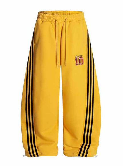 Model wearing Yellow street three stripe embroidered track by Grozavu
