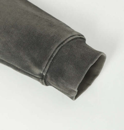 Close-up of the sleeve detailing of the Stripe Patchwork Hoodie – Loose Fit, showcasing soft fabric and cuff design.