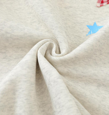 Close-up of the soft fabric of the Slanted Shoulder Retro Graffiti Hoodie showcasing colorful star graphics.