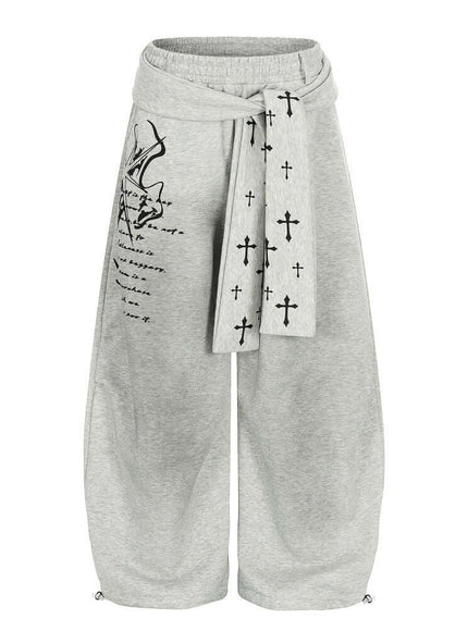 Model wearing Black graffiti cross dirty curved sweatpants by Grozavu