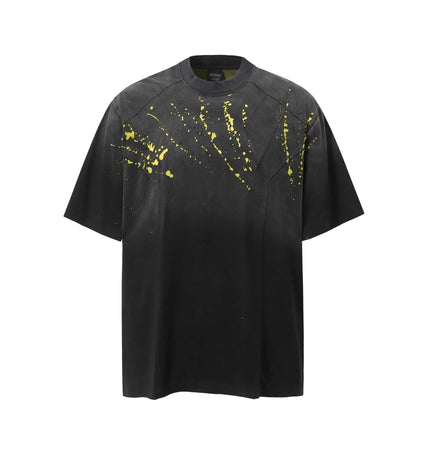 Retro Splatter Print TShirt – Loose Fit with high-street energy and bold yellow splatter design on a black background.