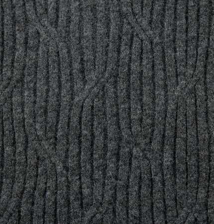 Close-up view of textured fabric for the Ripped Hem Knit Cardigan – Loose Fit in dark gray.