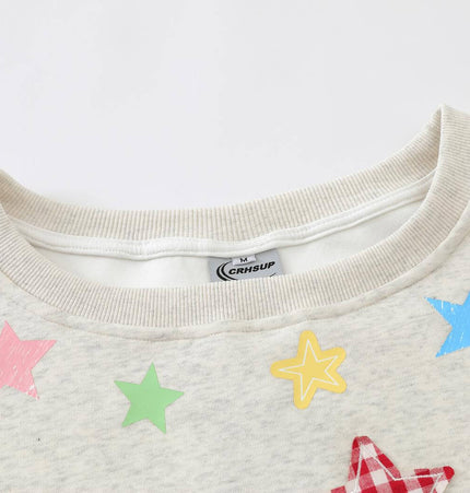 Slanted Shoulder Retro Graffiti Hoodie featuring a crew neckline and colorful star graphics on a soft fabric.