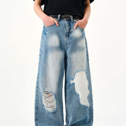 Casual Ripped Light Blue Jeans – Loose Fit showcasing a laid-back, vintage style with ripped detailing.
