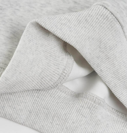 Casual Fit Plum Blossom Retro Hoodie close-up of soft cotton fabric and ribbed cuffs.