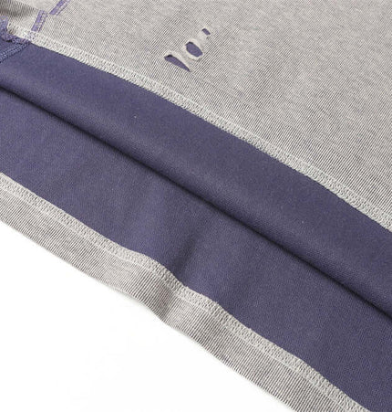 Distressed Short Sleeve TShirt – Loose Fit showcasing patchwork detailing and ripped elements for a stylish summer look.