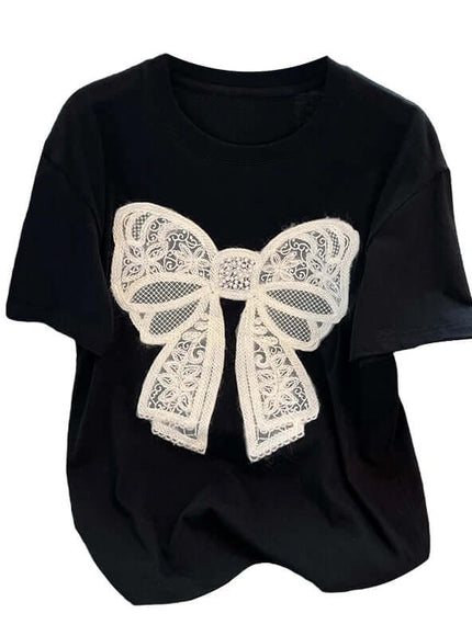 Model wearing black knitted bow detail tee by Grozavu