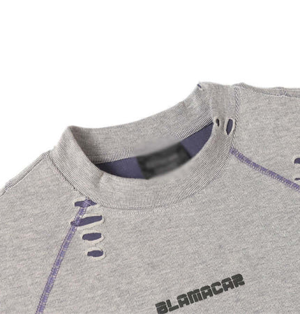 Distressed Short Sleeve TShirt – Loose Fit featuring unique patchwork and ripped detailing in a light gray color.