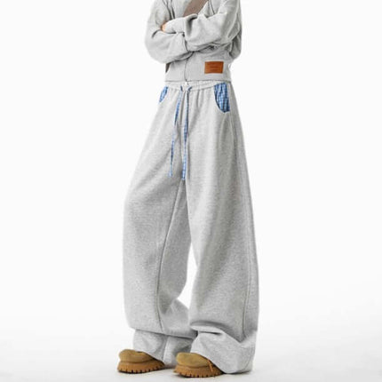 Loose Wide-Leg Sweatpants in gray with adjustable drawstring and wide-leg design, perfect for relaxed comfort.