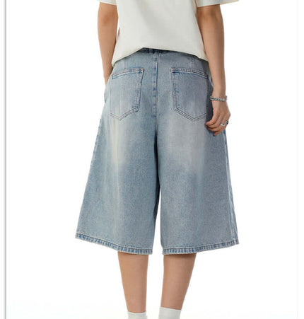 Washed Blue Denim Shorts – Loose Fit worn from the back, showcasing relaxed street style and vintage-inspired design.