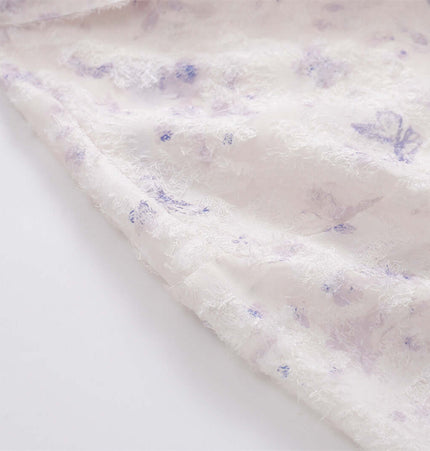 Butterfly Jacquard Printed Shirt fabric close-up showing delicate butterfly jacquard floral pattern in soft pastel colors.