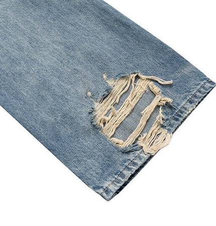 Close-up view of distressed hole detail on Distressed Hole Wide-Leg Denim Pants, showcasing the rugged vintage look.