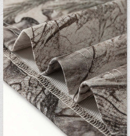 Camouflage Drop-Shoulder TShirt – Loose Fit fabric close-up showcasing branch camouflage pattern and soft texture.