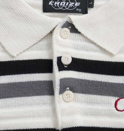 Color-Block Letter Knit Sweater - Loose Fit with striped detailing and embroidered letter accents.