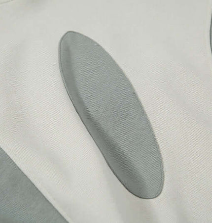 Close-up view of the fabric detail on the Color-Block Hooded Jacket – Loose Fit, showcasing unique splicing design.