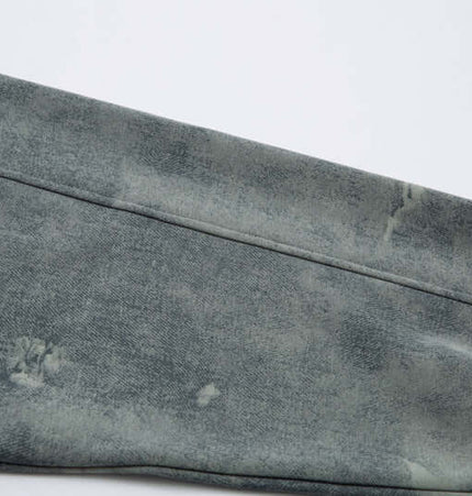 Close-up of the sleeve detail of the Letter Applique Washed Hoodie – Loose Fit in a vintage grey finish.