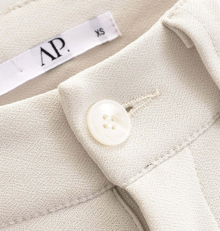 Close-up of the collar and button detail on the High Elastic Micro Flare Casual Pants.