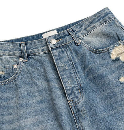 Distressed Hole Wide-Leg Denim Pants featuring bold ripped details and a relaxed silhouette for streetwear style.