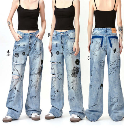 Distressed Denim Graffiti Print Trousers featuring bold graffiti designs and a relaxed fit, perfect for street style.